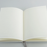 Open custom journal showing the interior writing pages