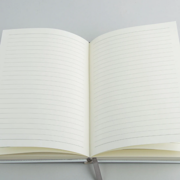 Open custom journal showing the interior writing pages