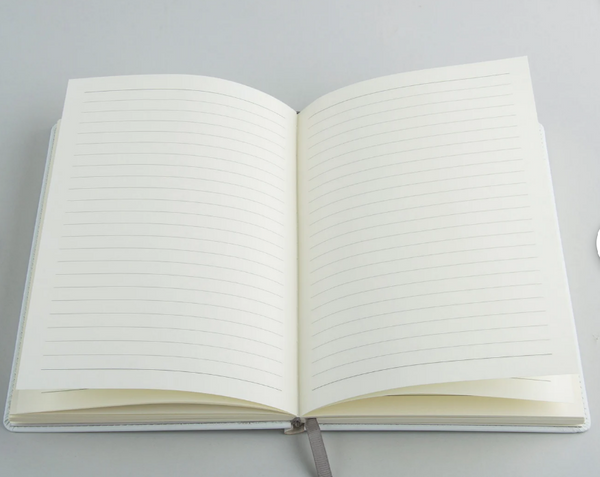 Open custom journal showing the interior writing pages