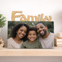 Personalized Sisters photo frame featuring a custom photograph displayed on a pink desk
